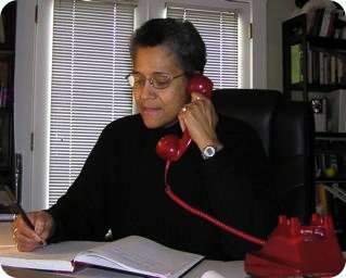 Photo of Marquita speaking on her Red Phone.